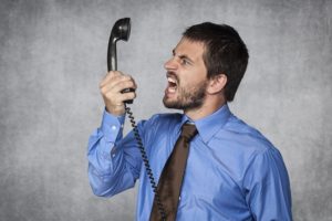 Man yelling into phone
