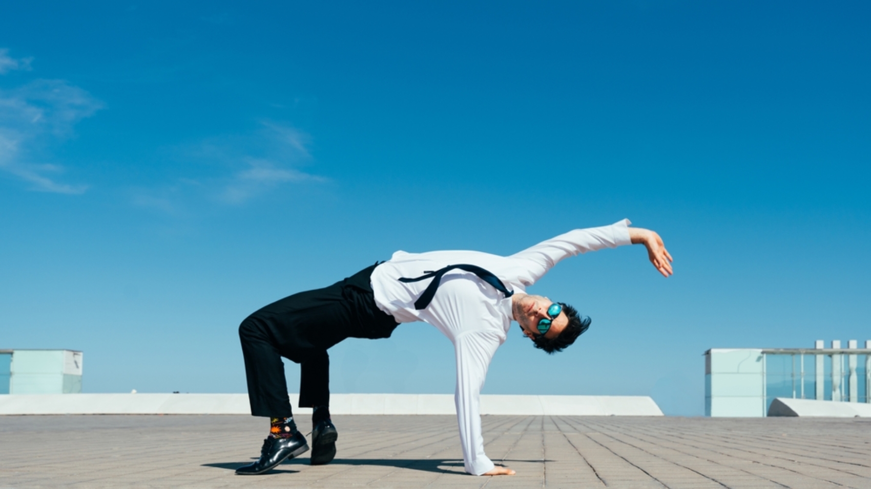 Happy,And,Handsome,Adult,Businessman,Wearing,Elegant,Suit,Doing,Acrobatic